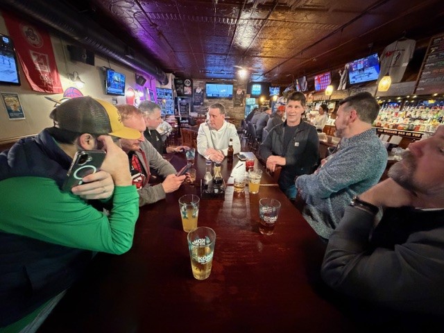 Group gathered at a bar after the Edison tour